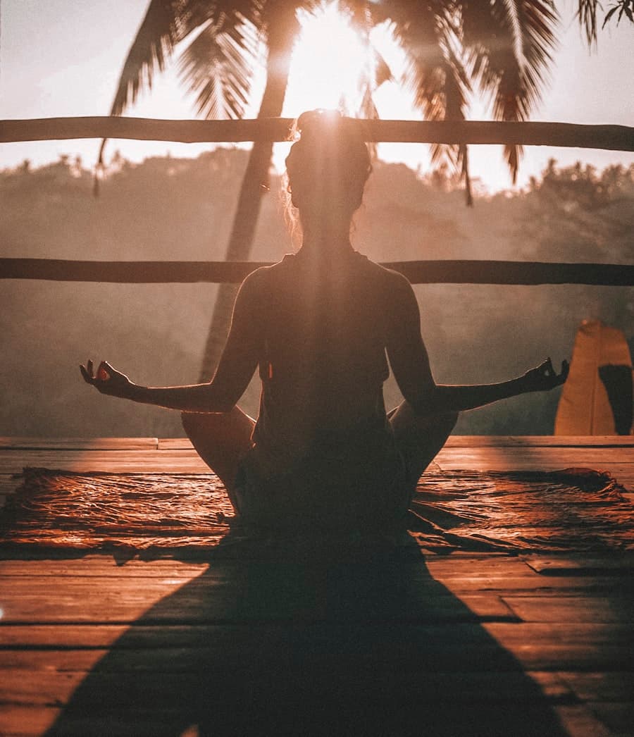Woman in peaceful meditation tracking cycle health